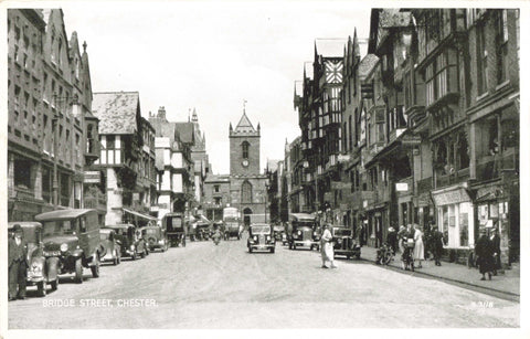 Vintage postcard showing old cars on Bridge Street Chester