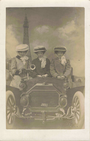 Old real photo postcard of 3 ladies with a motor car