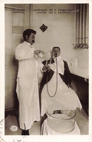 Real photo postcard showing a stomach wash procedure in Vichy, France