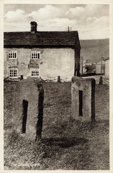 Old postcard of The Stocks, Eyam in Derbyshire